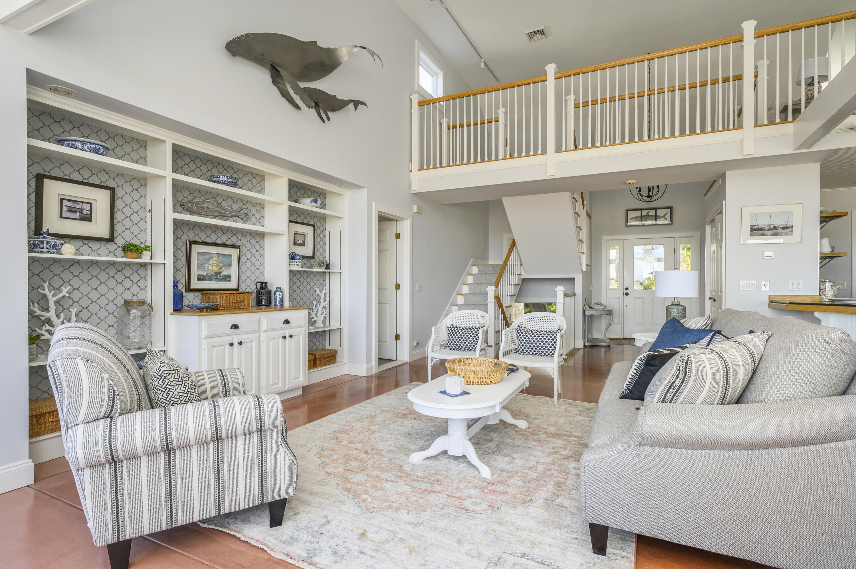 20 Partridge Way Wellfleet, MA 02667 - Photo 12 of 43 a living room with furniture a rug and a chandelier