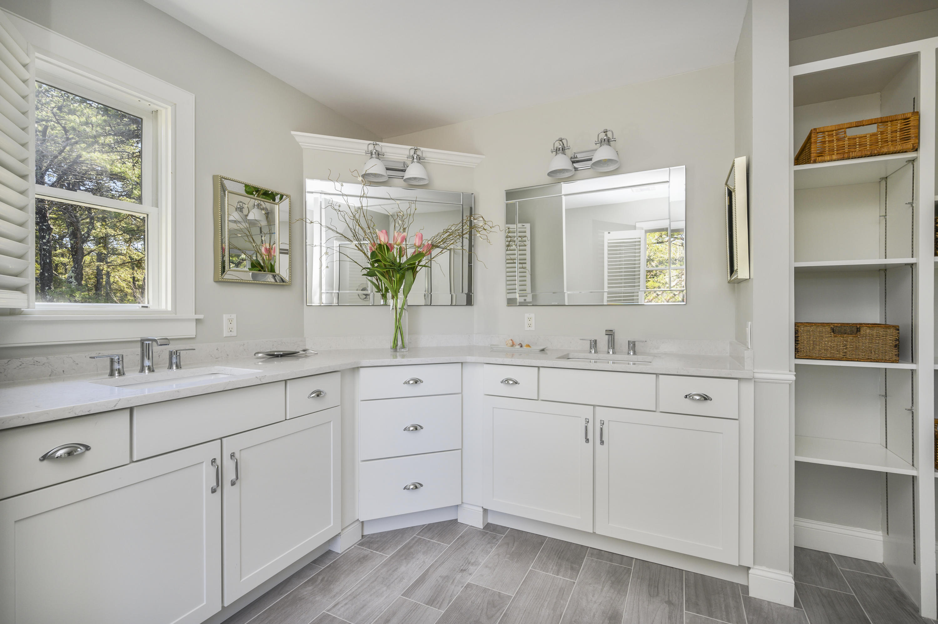 20 Partridge Way Wellfleet, MA 02667 - Photo 30 of 43 a spacious bathroom with double vanity sink a two mirror a window a vanity and shower