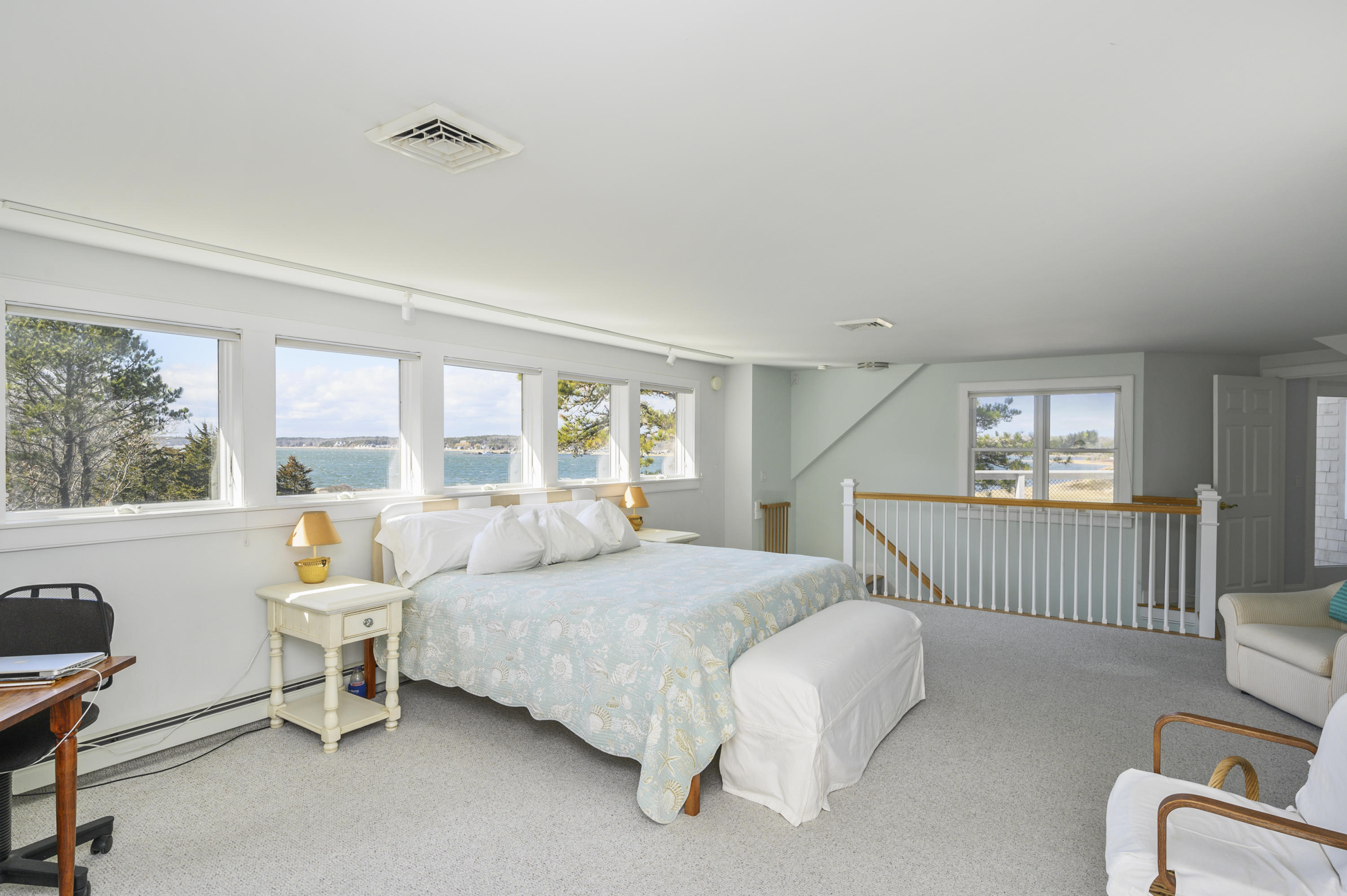 20 Partridge Way Wellfleet, MA 02667 - Photo 33 of 43 a spacious bedroom with a bed and a large window