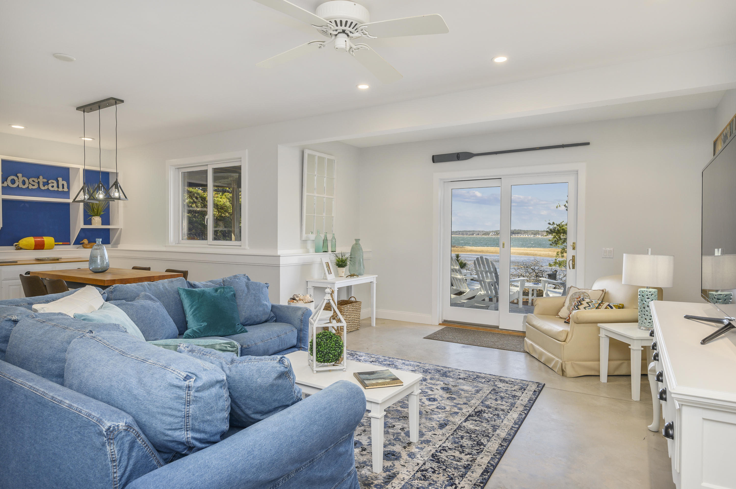 20 Partridge Way Wellfleet, MA 02667 - Photo 40 of 43 a living room with furniture and a large window