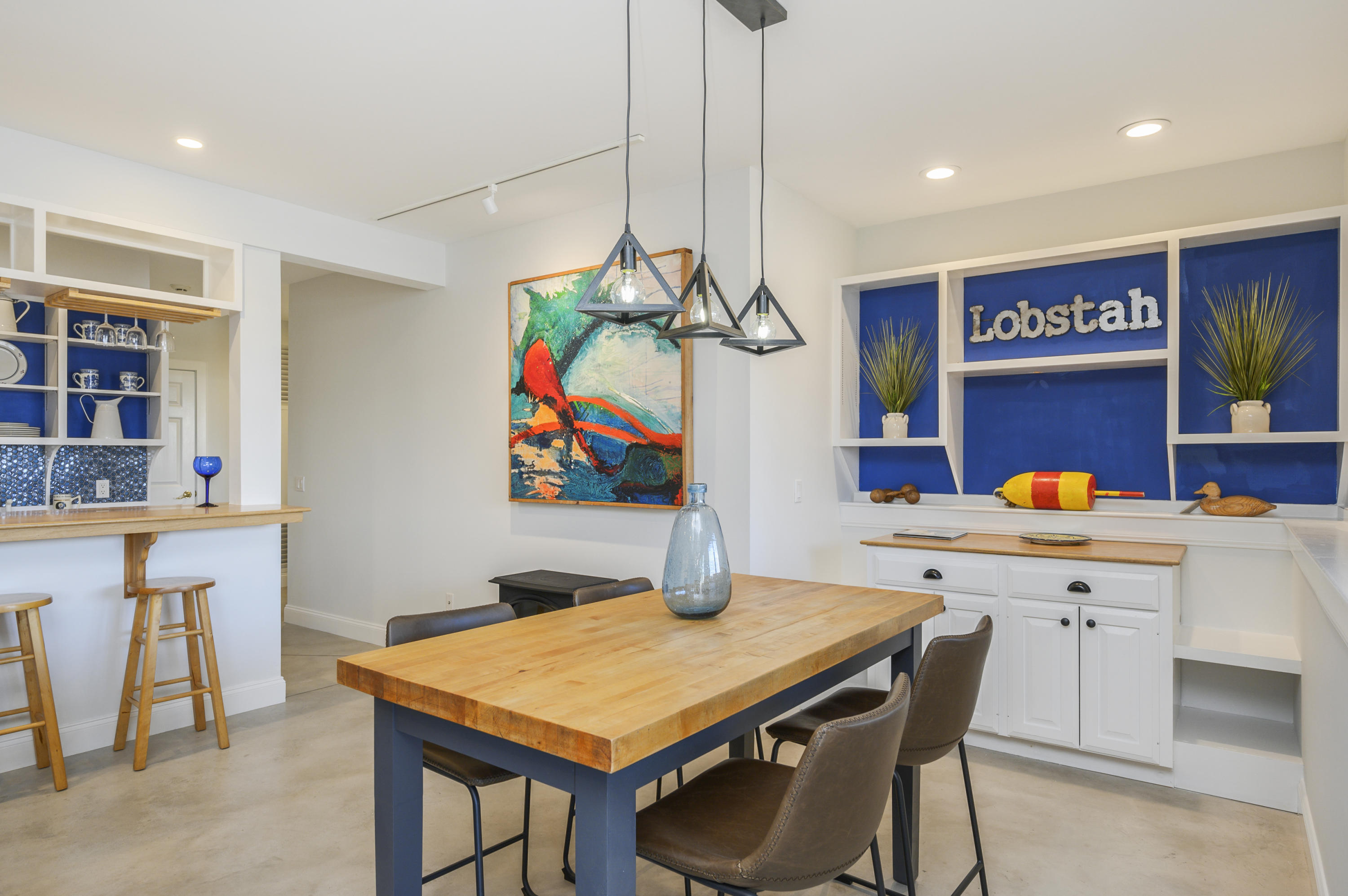 20 Partridge Way Wellfleet, MA 02667 - Photo 43 of 43 a room with stainless steel appliances kitchen island granite countertop a table chairs and a refrigerator