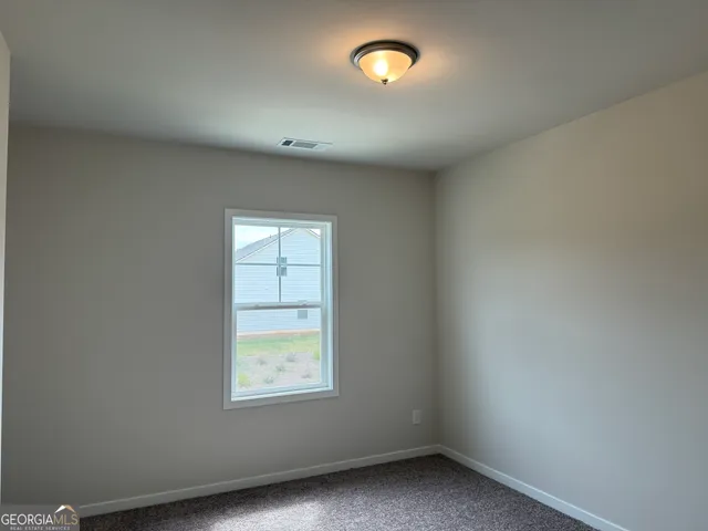 a view of a lake with couches in the patio