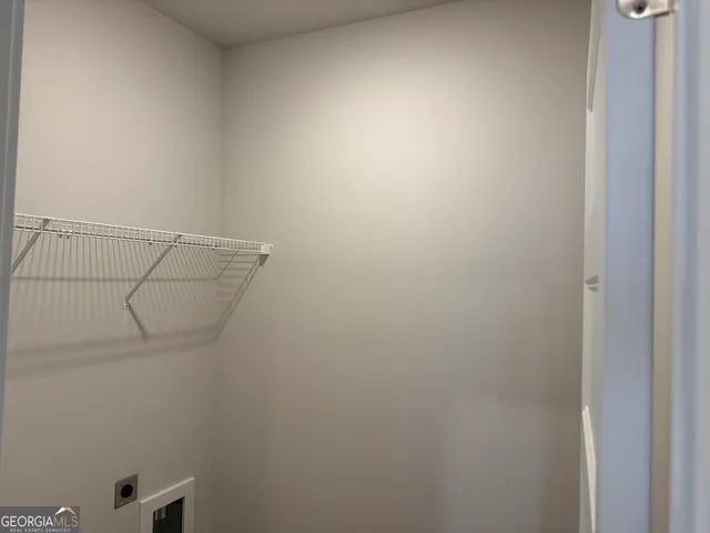 a view of a pathway of a house with a garden