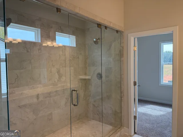 a front view of a house with a yard table and chairs