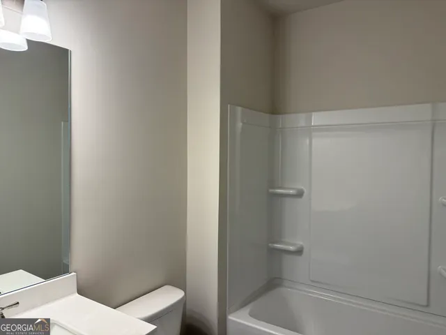 a view of kitchen with wooden floor and electronic appliances