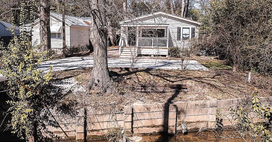 3305 Cherokee Avenue Columbus, GA 31906 - Photo 36 of 50 a front view of a house with yard and trees
