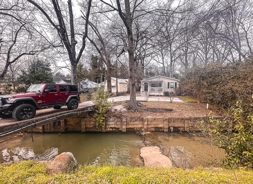 3305 Cherokee Avenue Columbus, GA 31906 - Photo 50 of 50 a front view of a house with lake view and boat