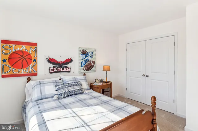 a bedroom with a bed and furniture