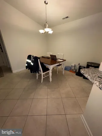 a view of a livingroom with furniture and chandelier