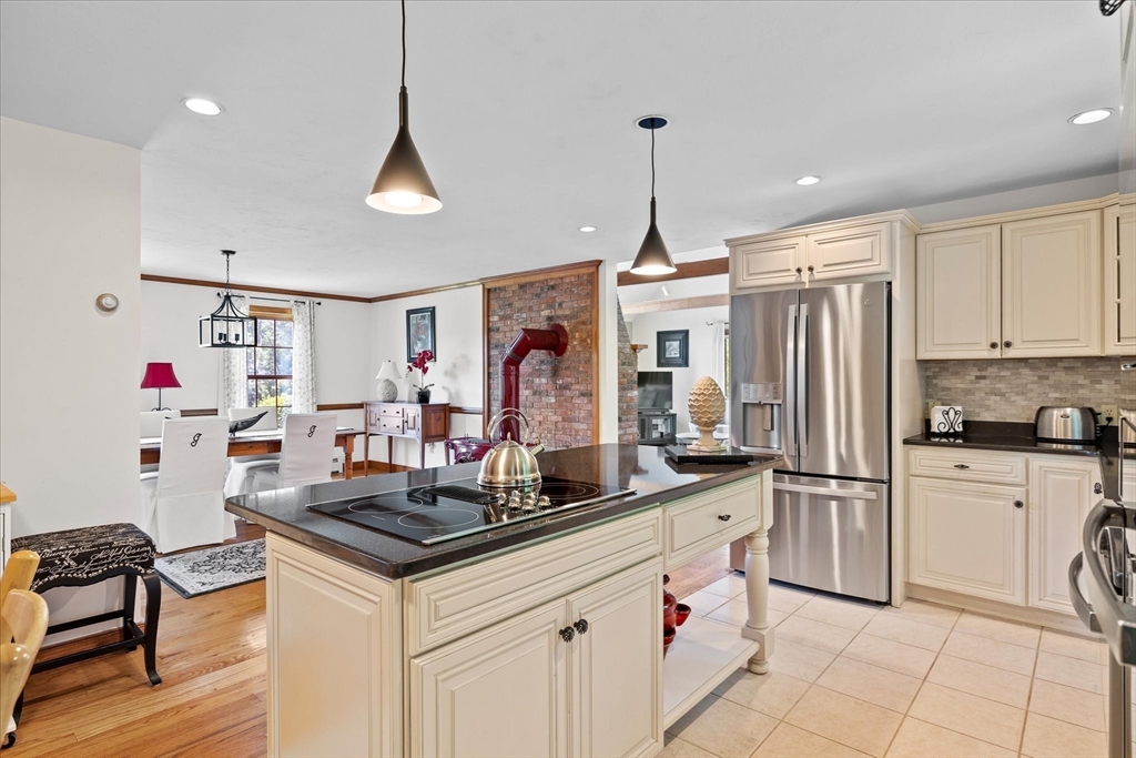 58 Rice Corner Road Brookfield, MA 01506 - Photo 12 of 41 a kitchen with stainless steel appliances granite countertop a sink and a refrigerator