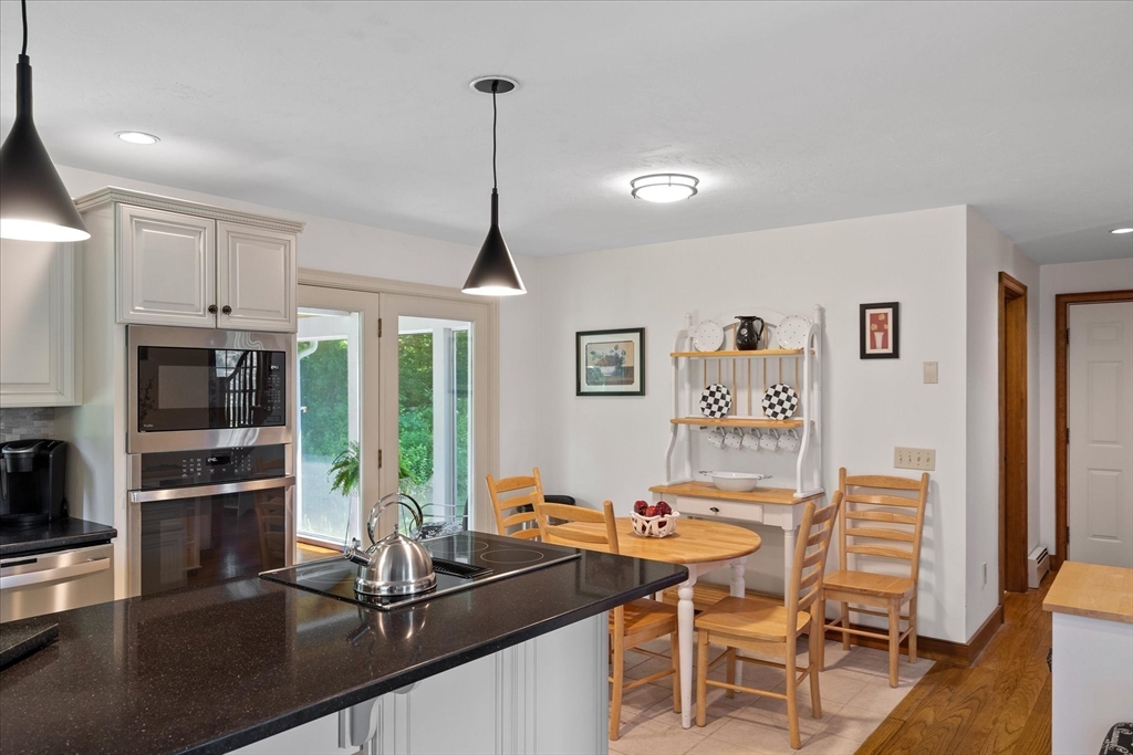 58 Rice Corner Road Brookfield, MA 01506 - Photo 13 of 41 a view of a dining room with furniture window and wooden floor