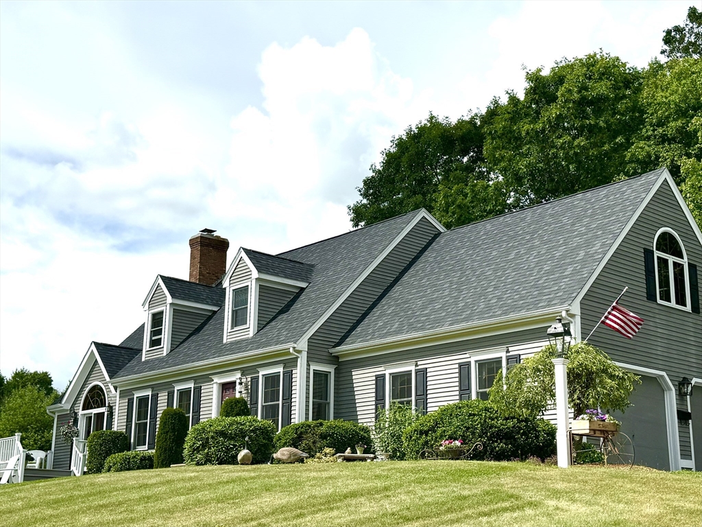 58 Rice Corner Road Brookfield, MA 01506 - Photo 2 of 41 a front view of a house with a yard