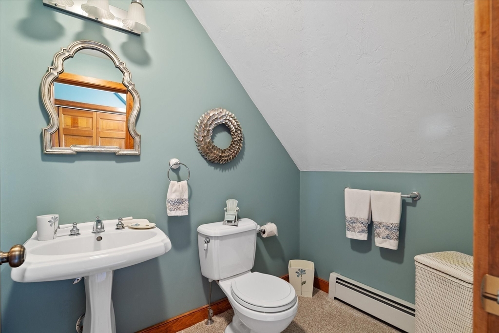 58 Rice Corner Road Brookfield, MA 01506 - Photo 22 of 41 a bathroom with a toilet sink and mirror