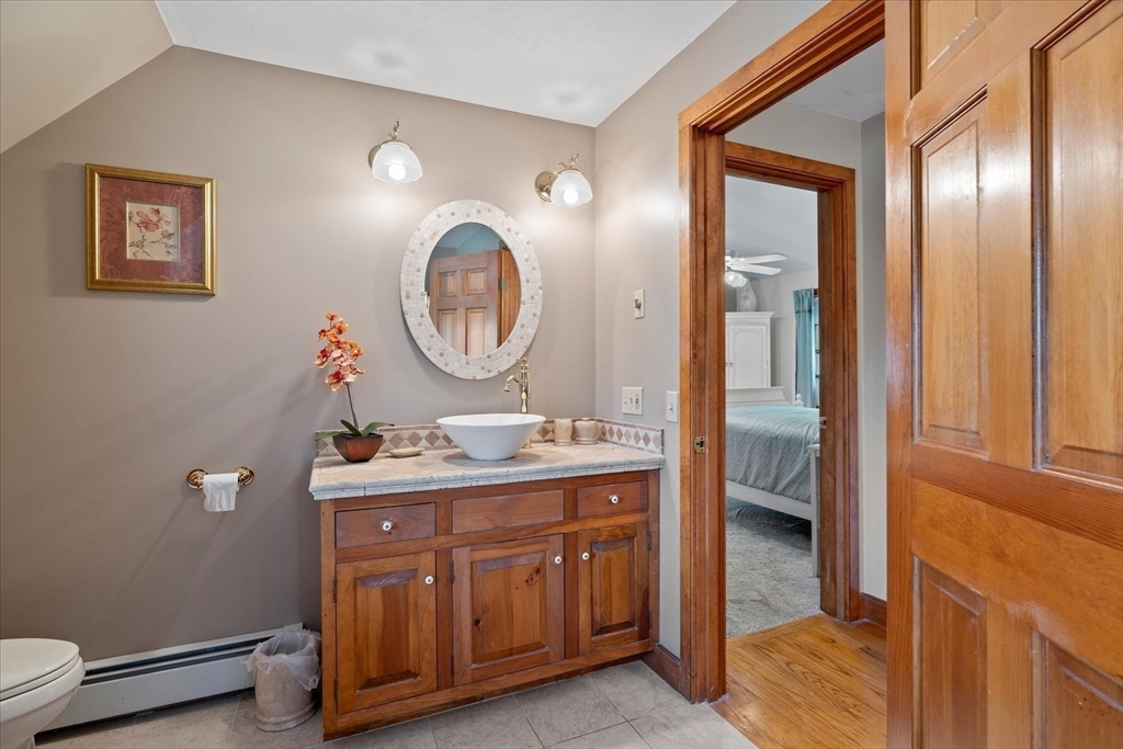 58 Rice Corner Road Brookfield, MA 01506 - Photo 27 of 41 a bathroom with a double vanity sink and a mirror