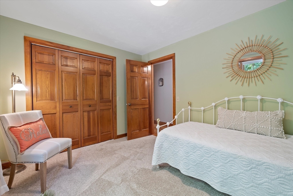 58 Rice Corner Road Brookfield, MA 01506 - Photo 30 of 41 a bedroom with a bed and a chair
