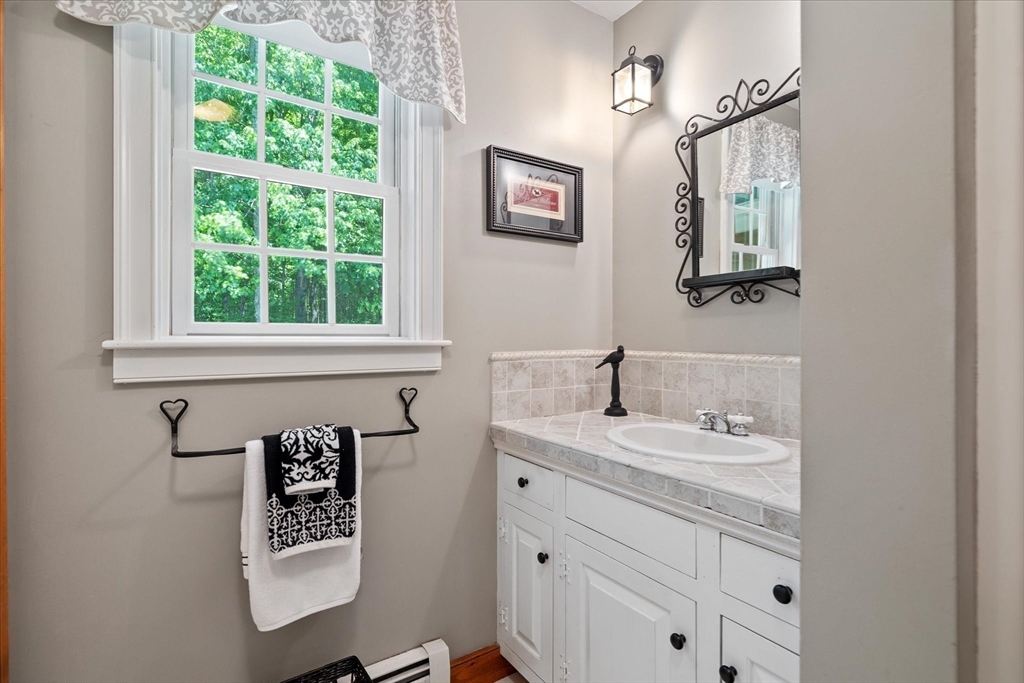 58 Rice Corner Road Brookfield, MA 01506 - Photo 31 of 41 a bathroom with a sink and a mirror