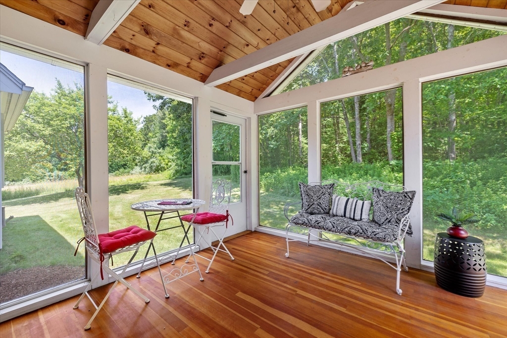 58 Rice Corner Road Brookfield, MA 01506 - Photo 32 of 41 a room with furniture and wooden floor