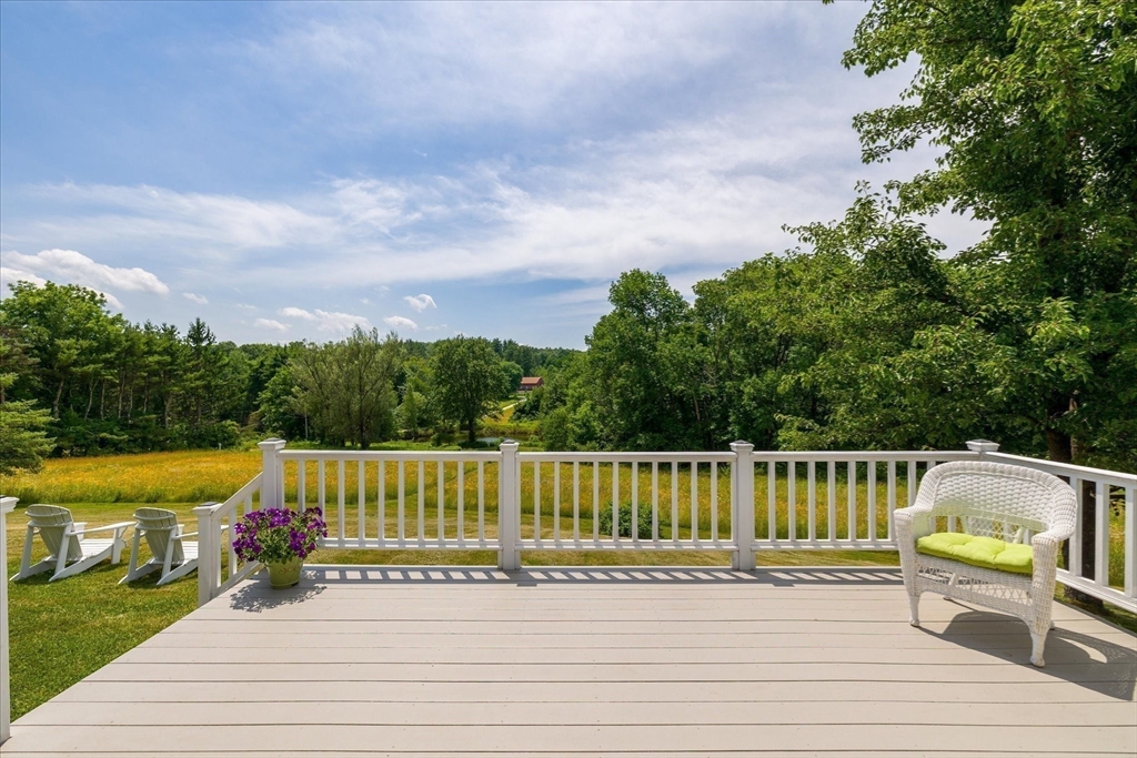 58 Rice Corner Road Brookfield, MA 01506 - Photo 36 of 41 a view of a terrace with a bench and trees