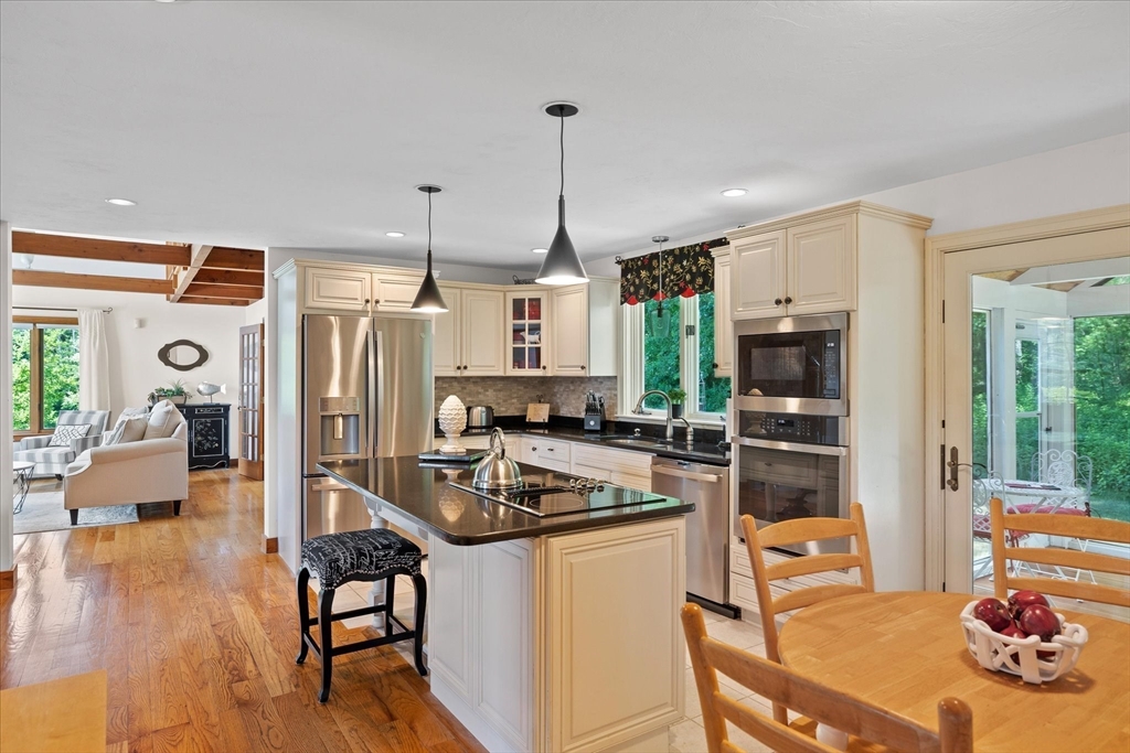 58 Rice Corner Road Brookfield, MA 01506 - Photo 10 of 41 a kitchen with stainless steel appliances granite countertop a sink stove and refrigerator