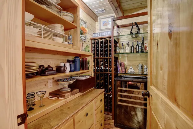 a kitchen with a cabinets and wooden floor