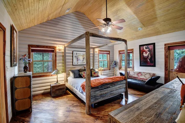 a bedroom with furniture and window