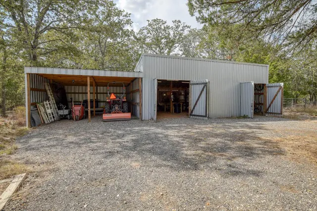 a view of a house with a space and garage