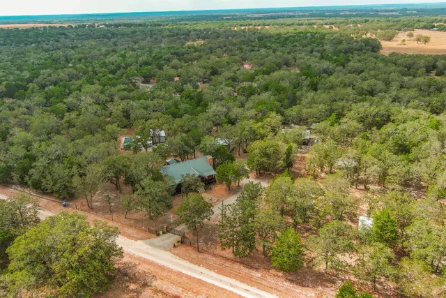 a view of a field with an ocean view