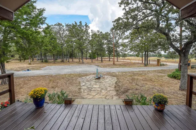 a view of a yard with wooden floor