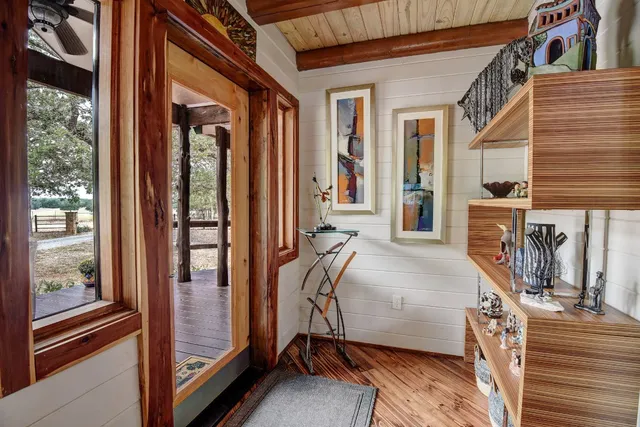 a bedroom with furniture and a window