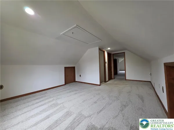 a view of hallway with stairs and closet