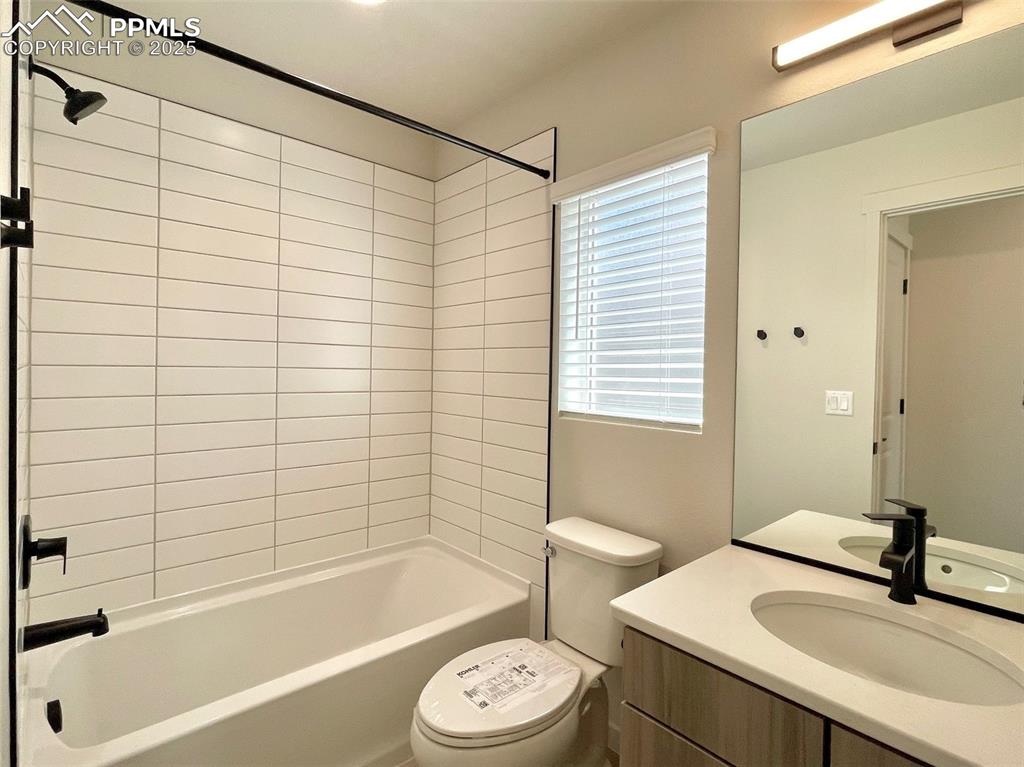 3535 Greenways Main Boulevard Colorado Springs, CO 80922 - Photo 12 of 22 a bathroom with a sink a toilet and bathtub