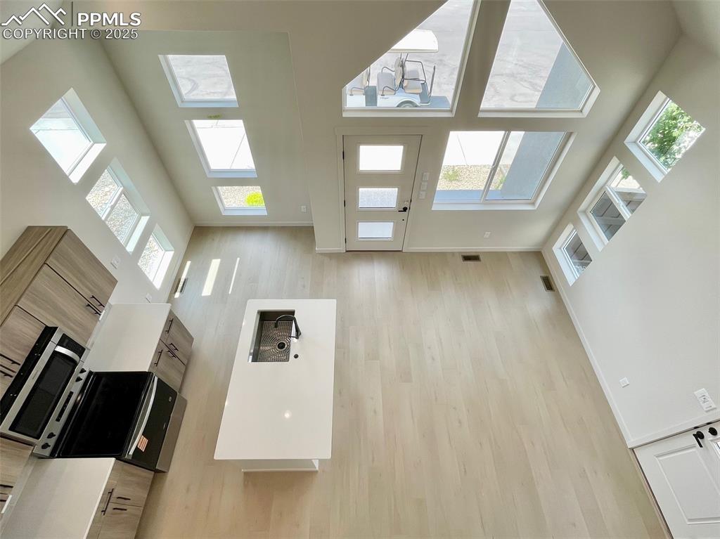 3535 Greenways Main Boulevard Colorado Springs, CO 80922 - Photo 22 of 22 a view of an entryway with wooden floor