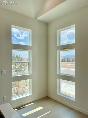 a view of an empty room with a window