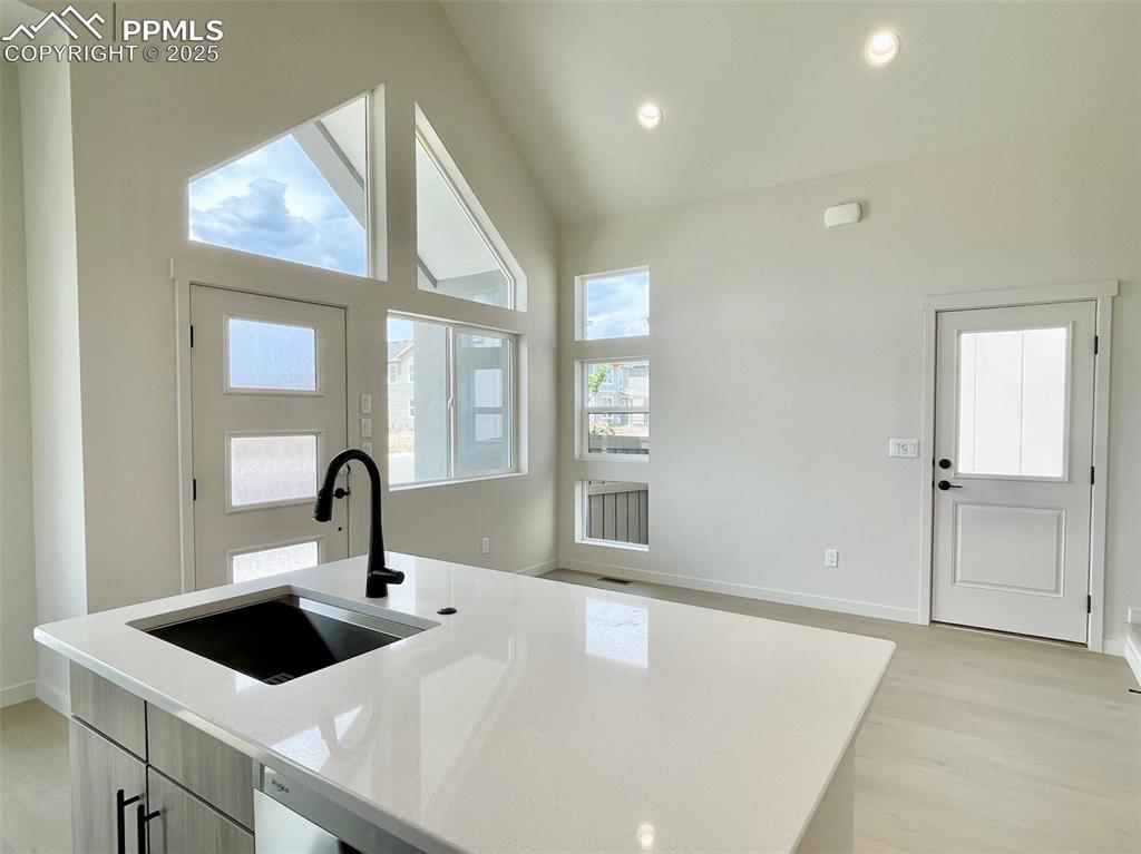 3535 Greenways Main Boulevard Colorado Springs, CO 80922 - Photo 10 of 22 a front view of a house with a sink and wooden floor