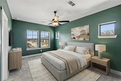 a spacious bedroom with a large bed and a window