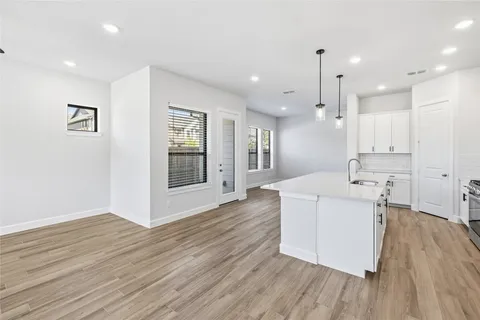 a bathroom with a sink a mirror and a window