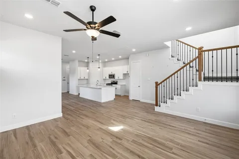 a view of kitchen with wooden floor and window
