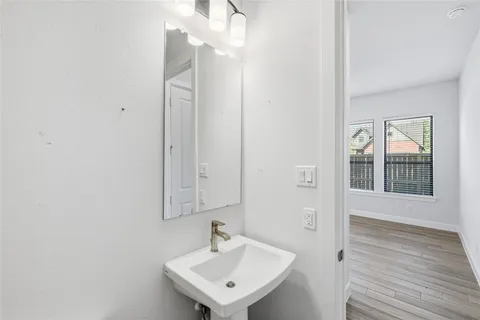 a view of a house with wooden fence