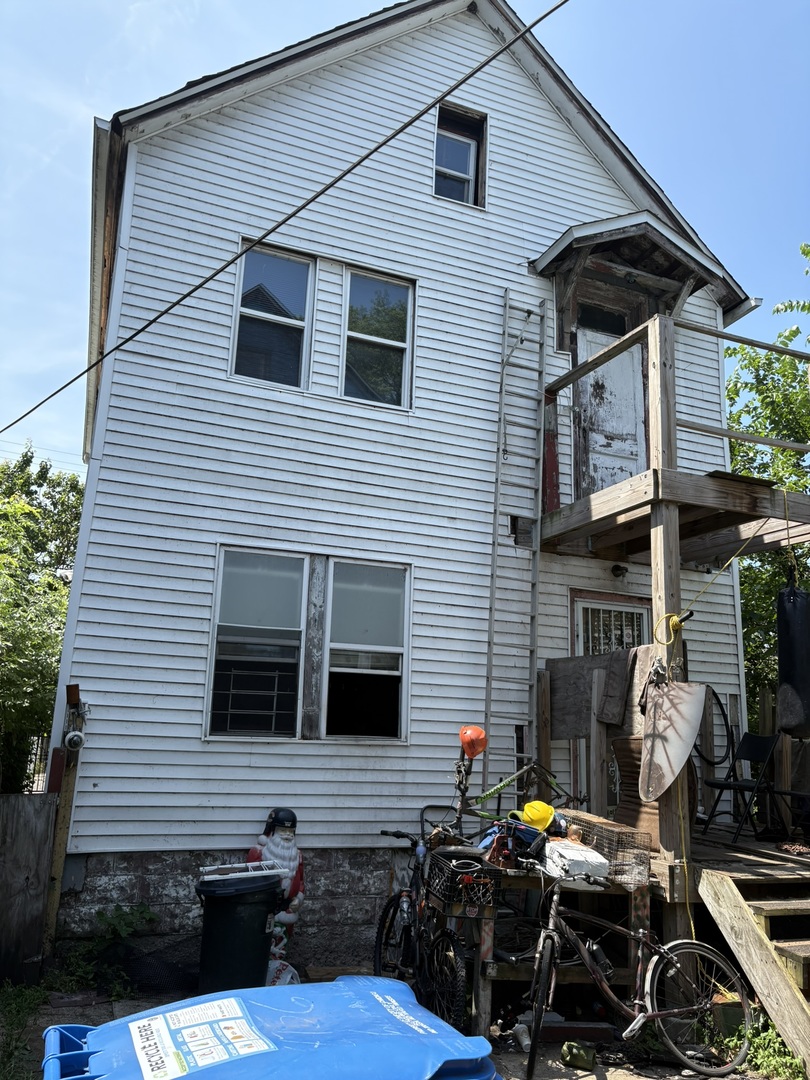 8750 South Exchange Avenue Chicago, IL 60617 - Photo 2 of 11 a view of a house with a patio