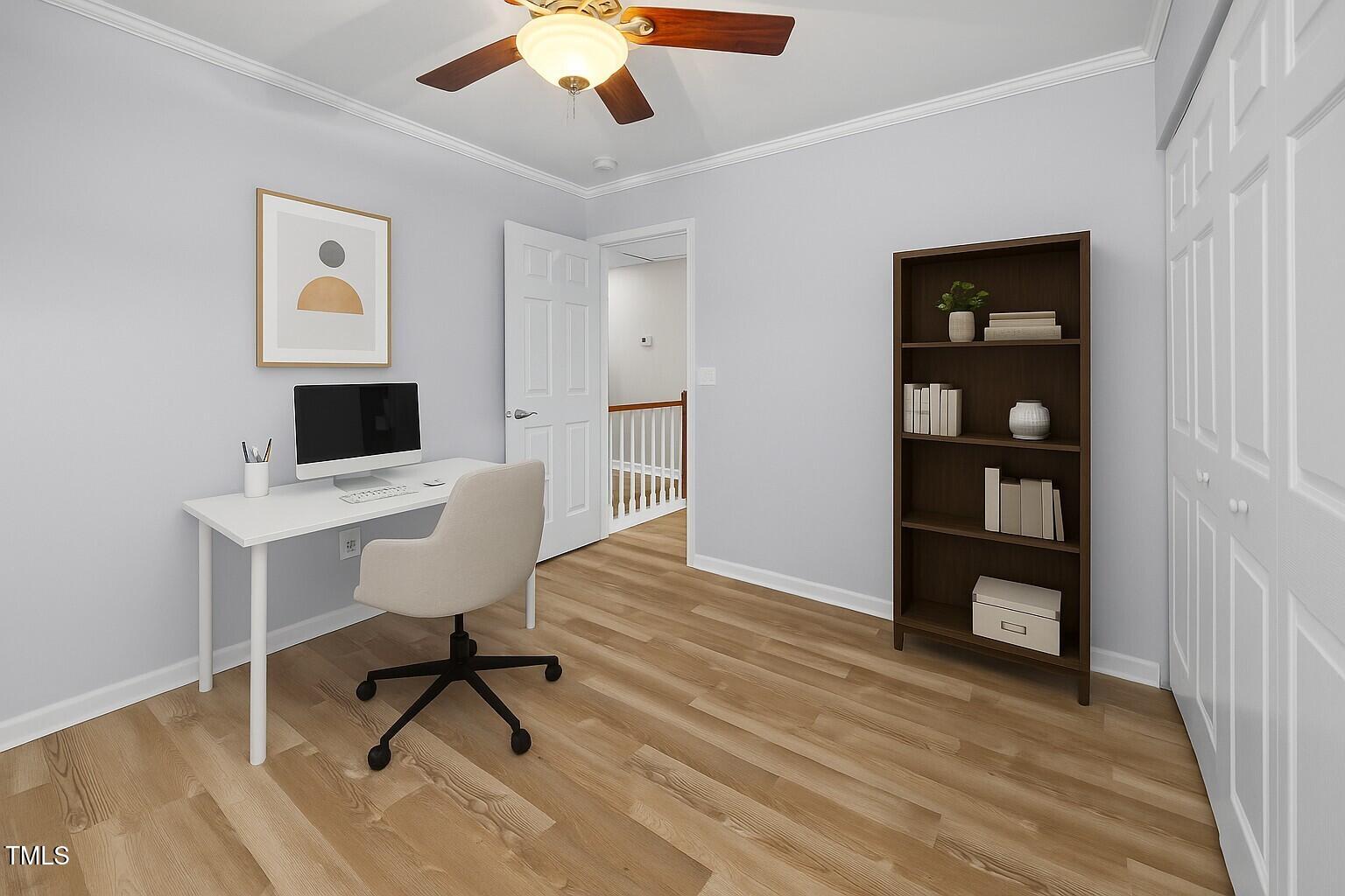5561 Roan Mountain Place Raleigh, NC 27613 - Photo 14 of 20 a view of a workspace with furniture and wooden floor