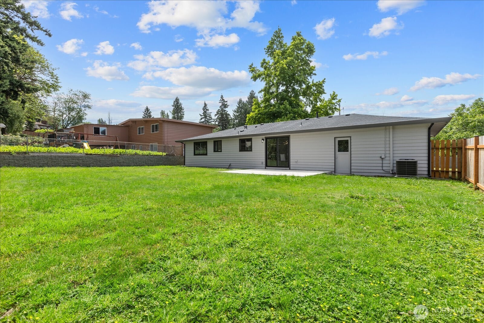 10646 Southeast 236th Street Kent, WA 98031 - Photo 19 of 20 a view of a house with a backyard