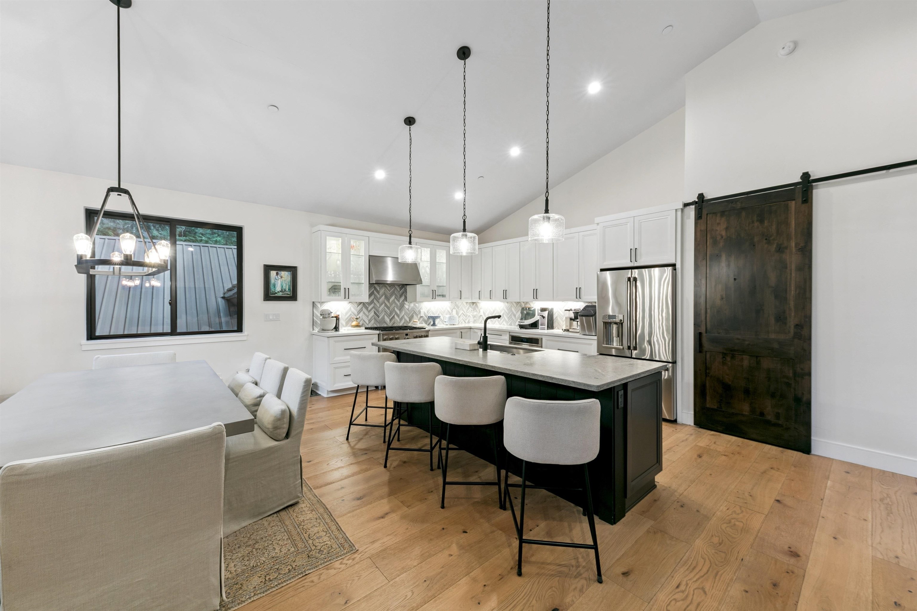 7247 9th Avenue Tahoma, CA 96142 - Photo 12 of 28 a kitchen island with stainless steel appliances kitchen island granite countertop furniture and a view of living room