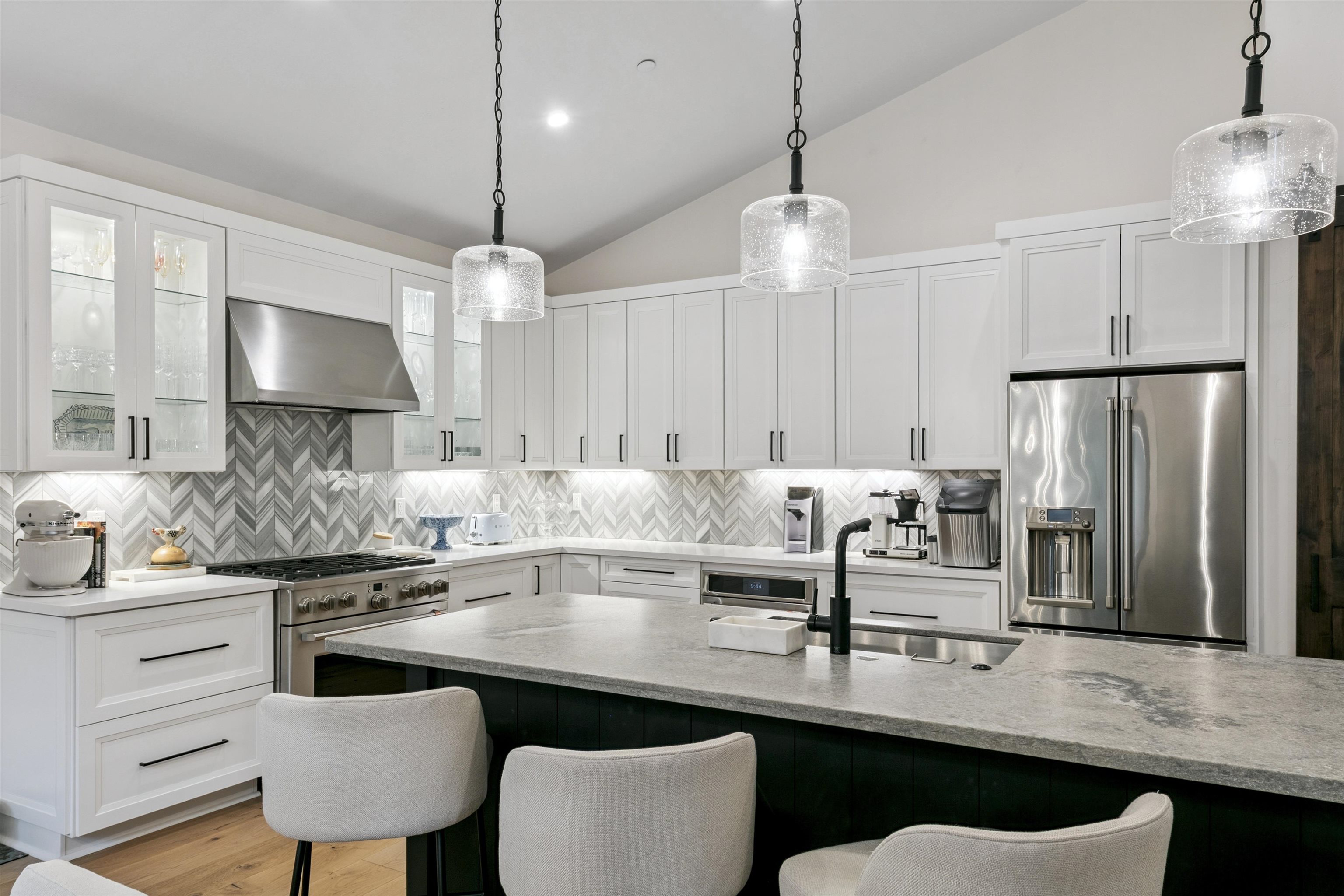 7247 9th Avenue Tahoma, CA 96142 - Photo 13 of 28 a kitchen with granite countertop a counter space chairs cabinets and stainless steel appliances