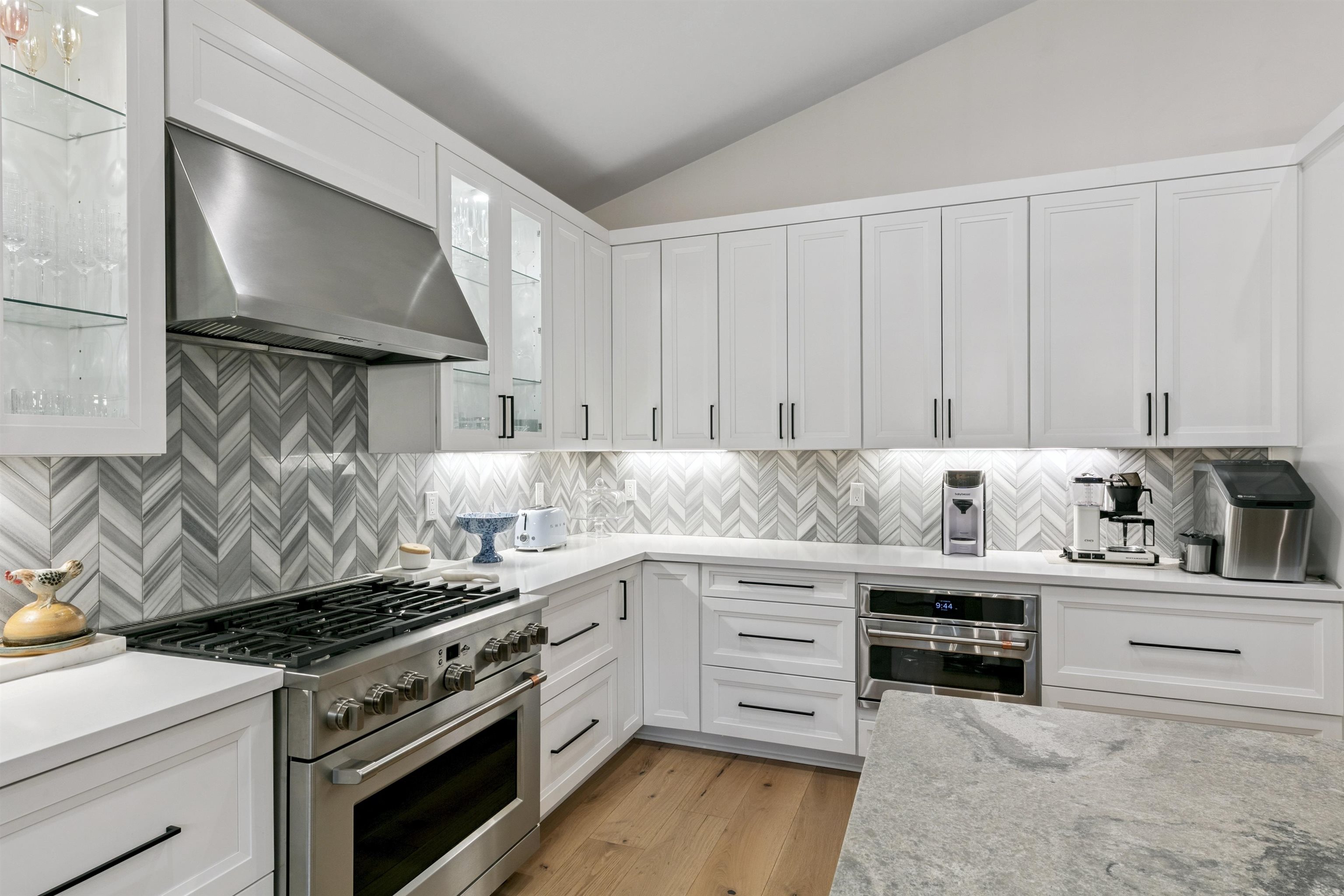 7247 9th Avenue Tahoma, CA 96142 - Photo 15 of 28 a kitchen with stainless steel appliances a stove a sink and white cabinets