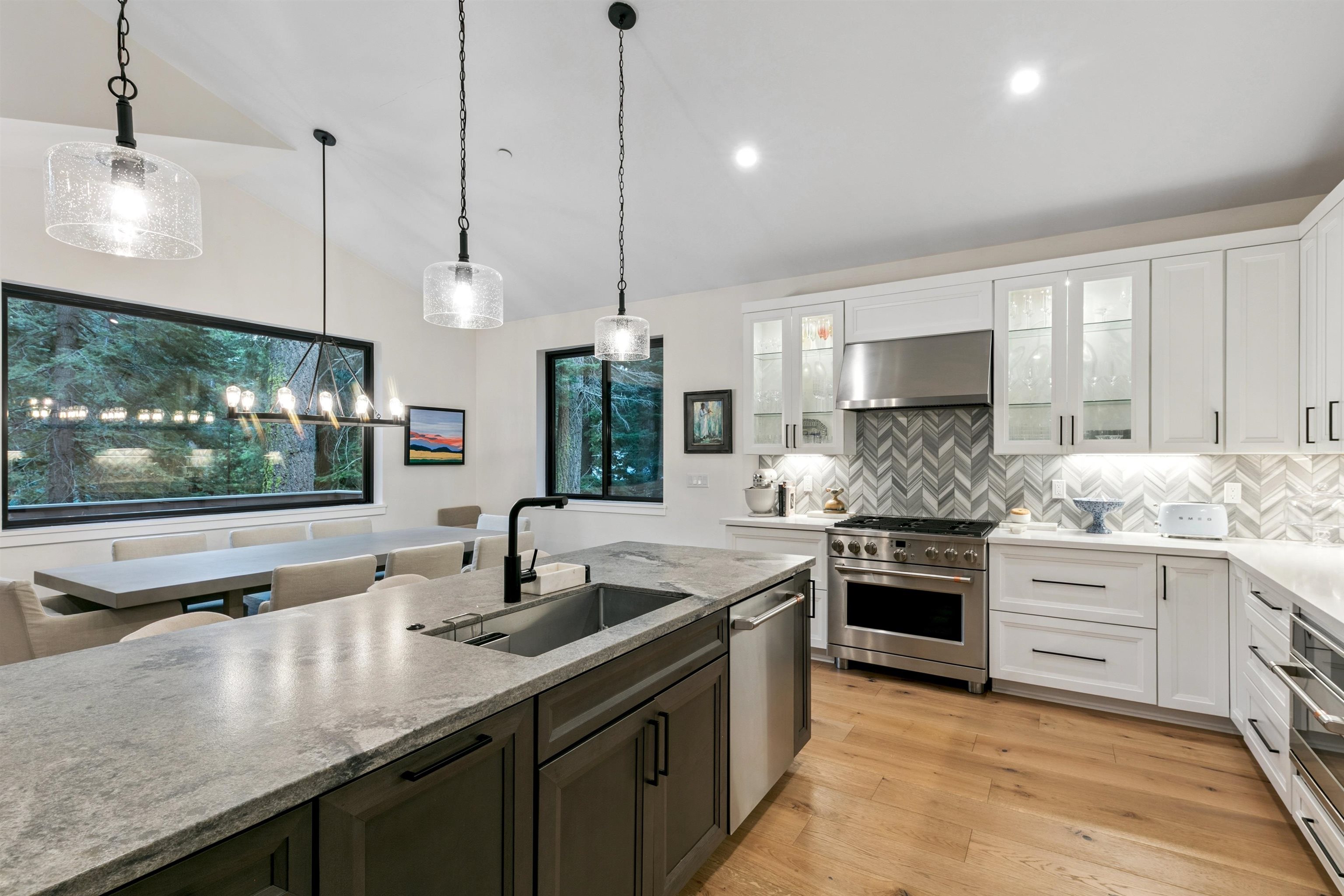 7247 9th Avenue Tahoma, CA 96142 - Photo 16 of 28 a kitchen with stainless steel appliances granite countertop a sink stove and refrigerator