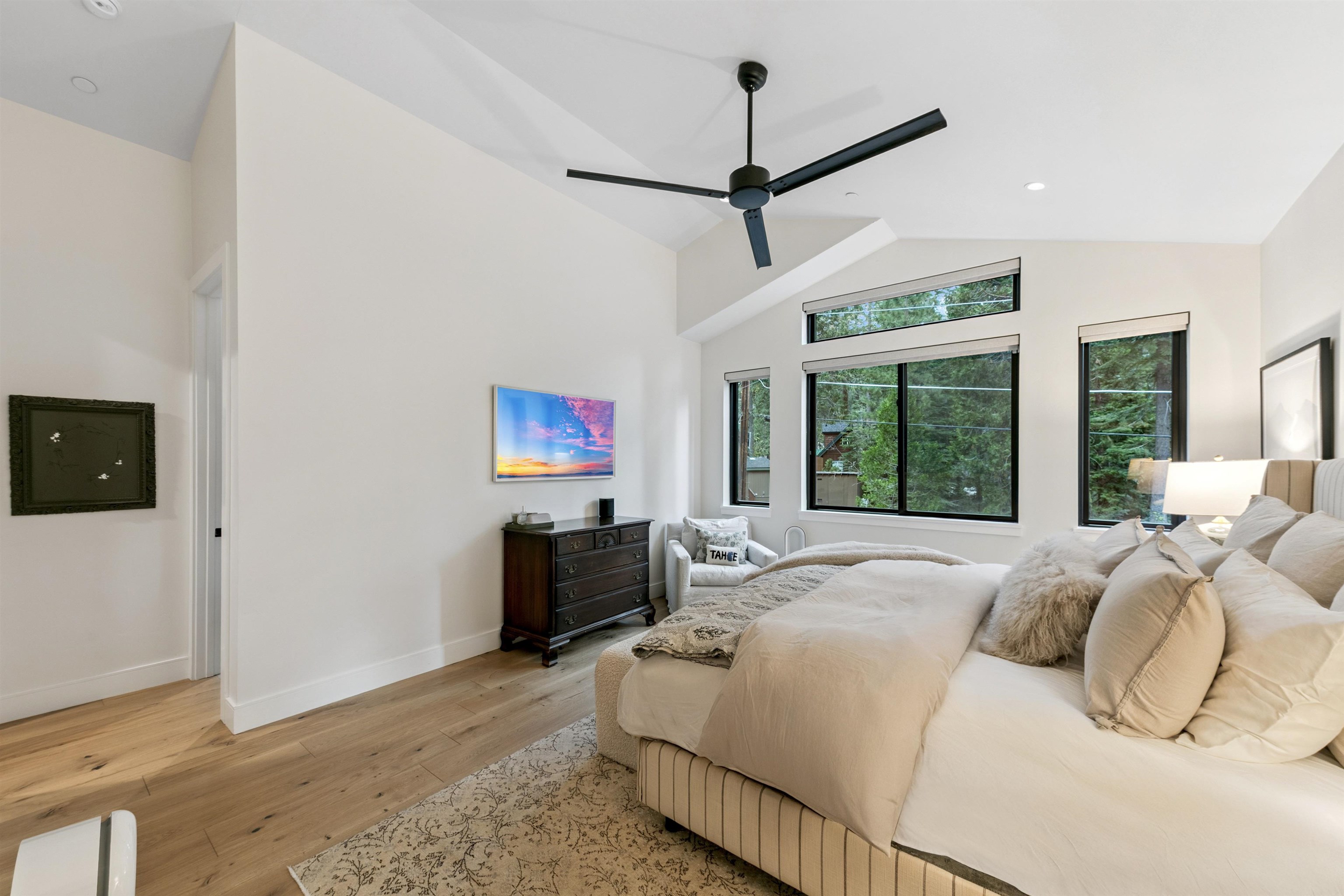 7247 9th Avenue Tahoma, CA 96142 - Photo 17 of 28 a bedroom with a bed and a flat screen tv