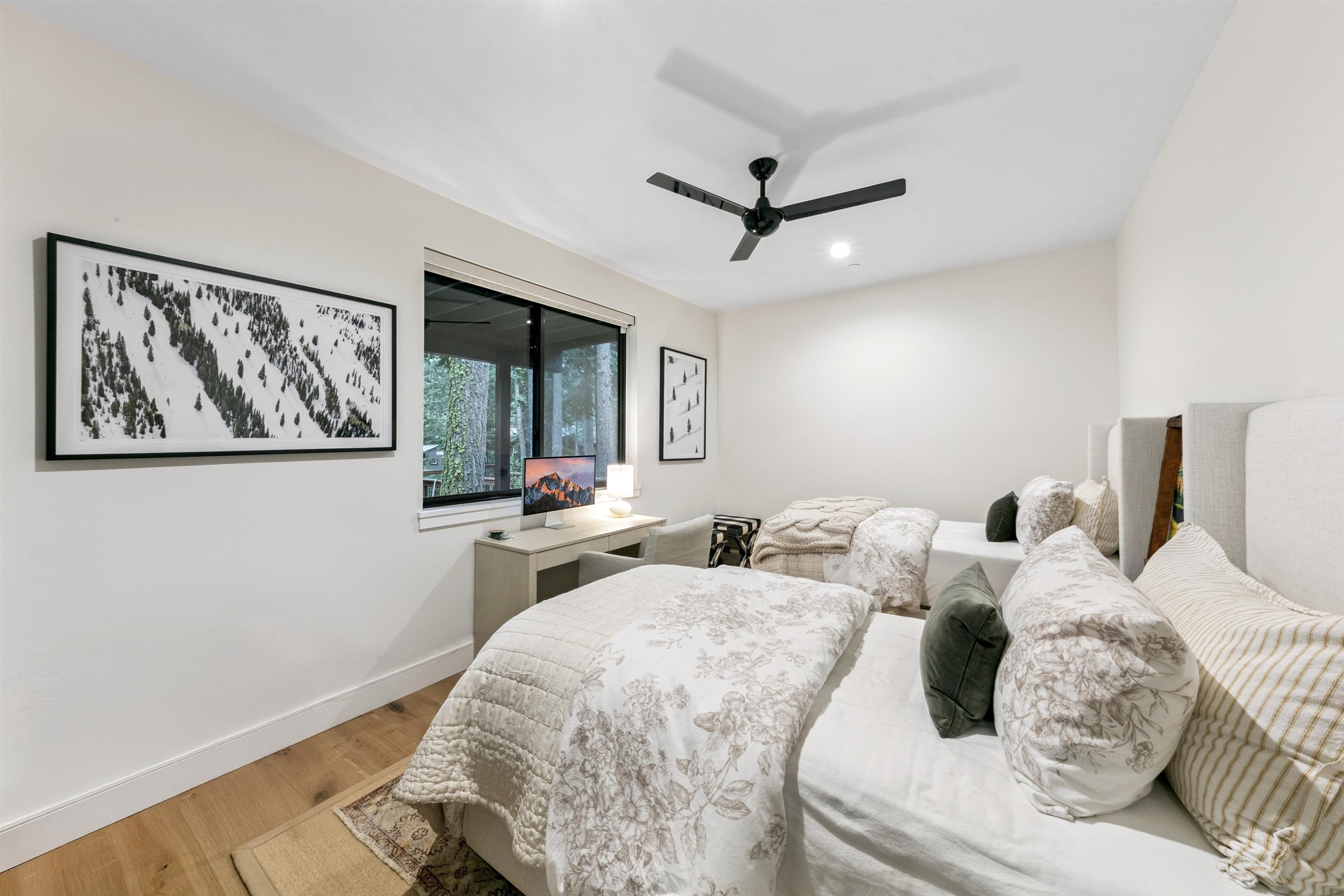 7247 9th Avenue Tahoma, CA 96142 - Photo 26 of 28 a bedroom with a large bed and a painting on the wall
