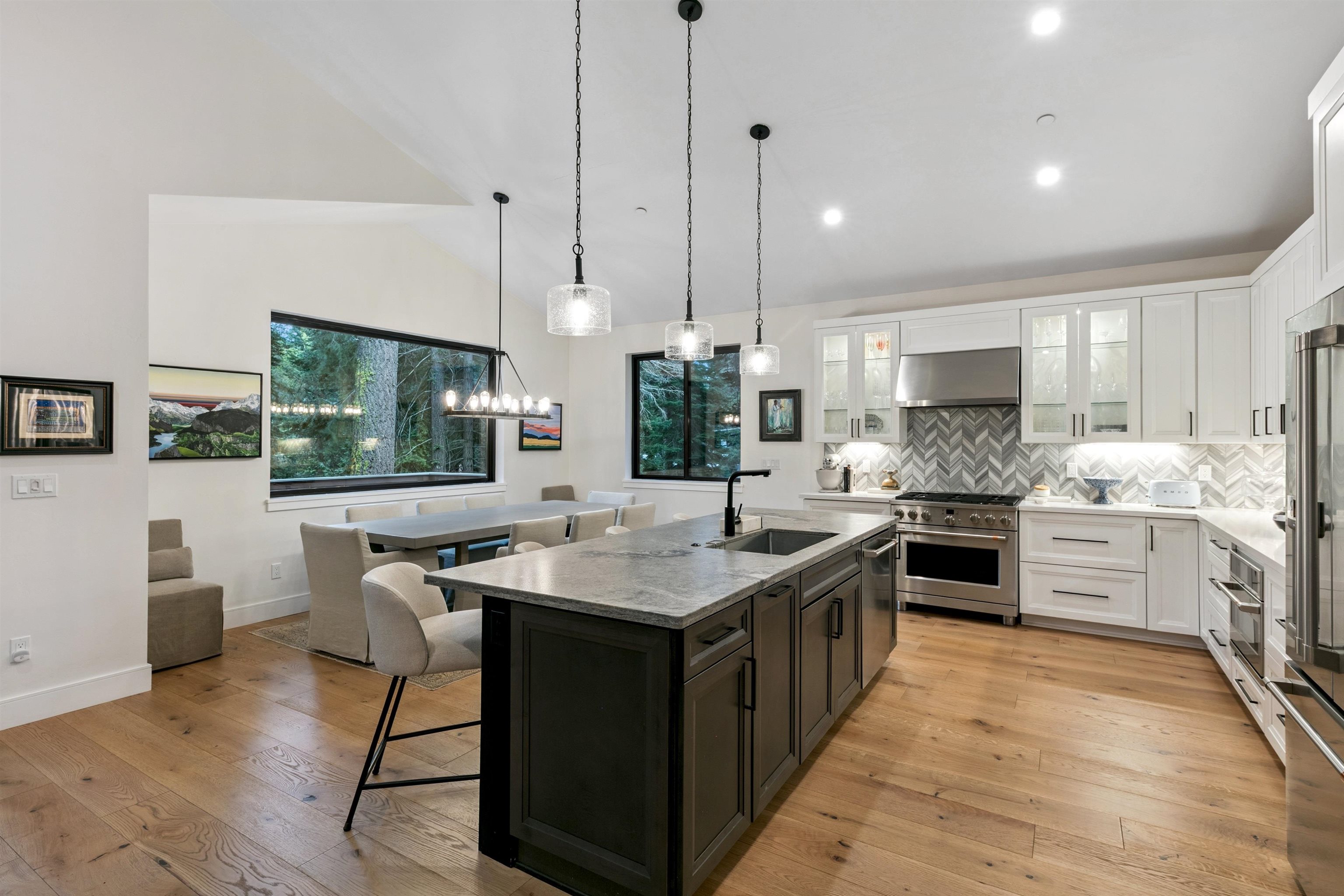 7247 9th Avenue Tahoma, CA 96142 - Photo 10 of 28 a kitchen with stainless steel appliances kitchen island a large island in the center