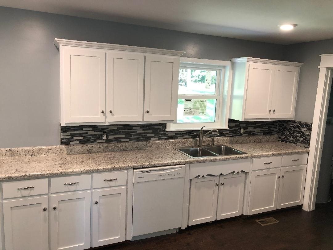 361 Green Shadow Road Cleveland, TN 37323 - Photo 13 of 33 a kitchen with white cabinets and sink