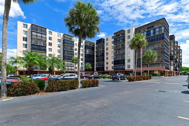a view of swimming pool with outdoor seating and a patio